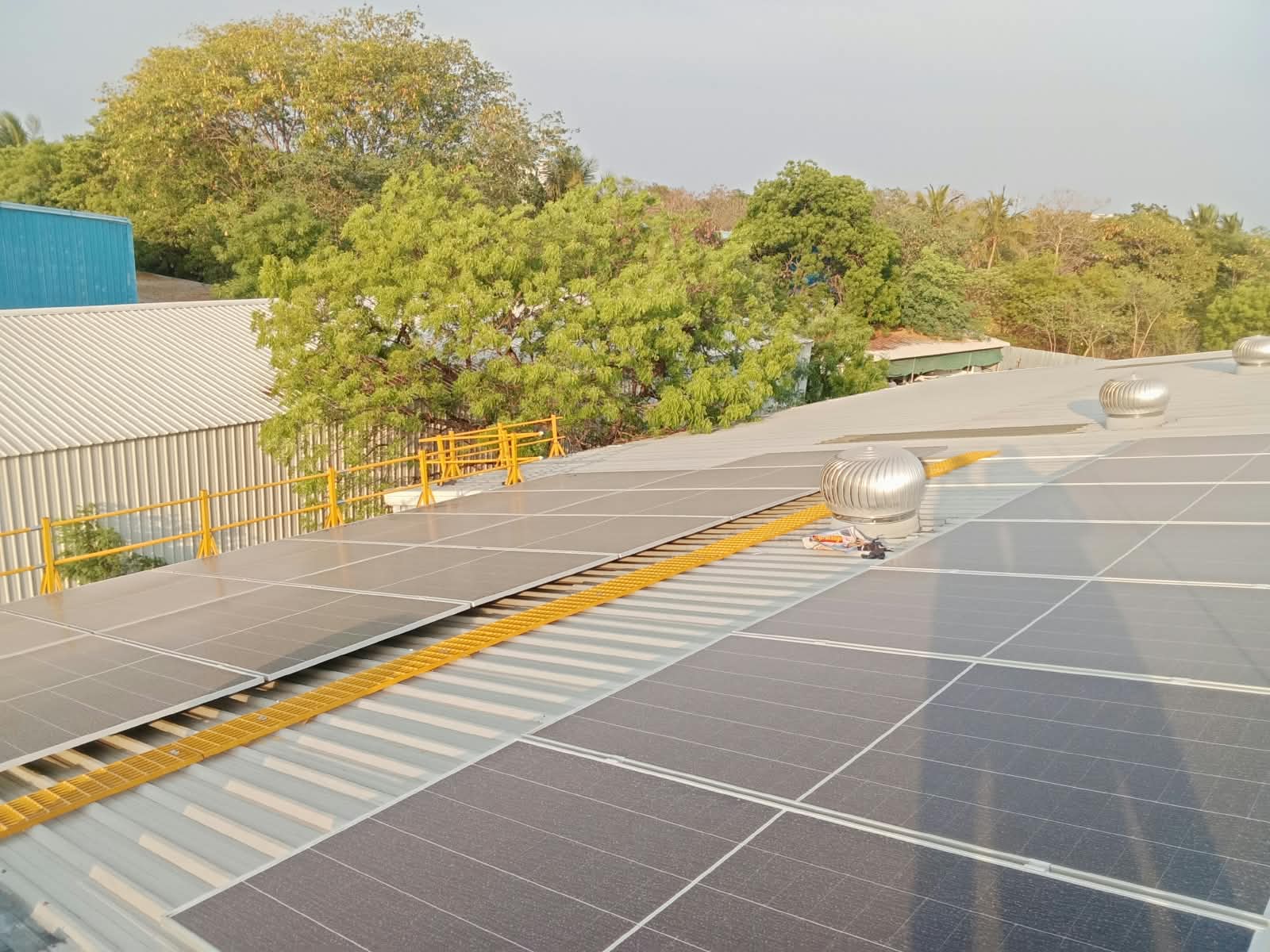 Solar panels installed on an industrial roof