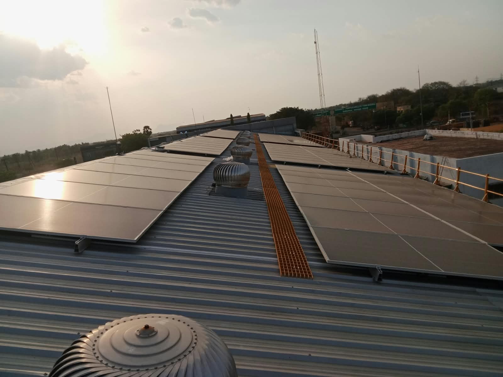 Commercial rooftop solar installation at sunset